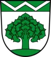 Wappen von Werneuchen: grüner Baum, silberne Zickzacklinie auf Weiß.